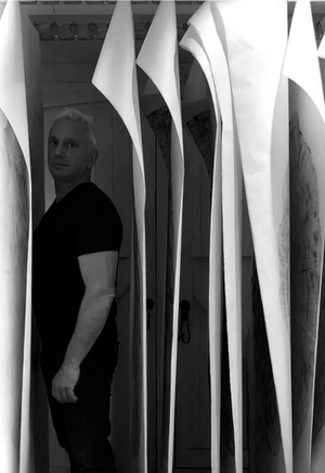 Jonathan Ford with drying rack in studio